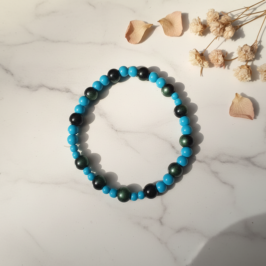 Turquoise and dark green black metallic bead stretch bracelet lifestyle