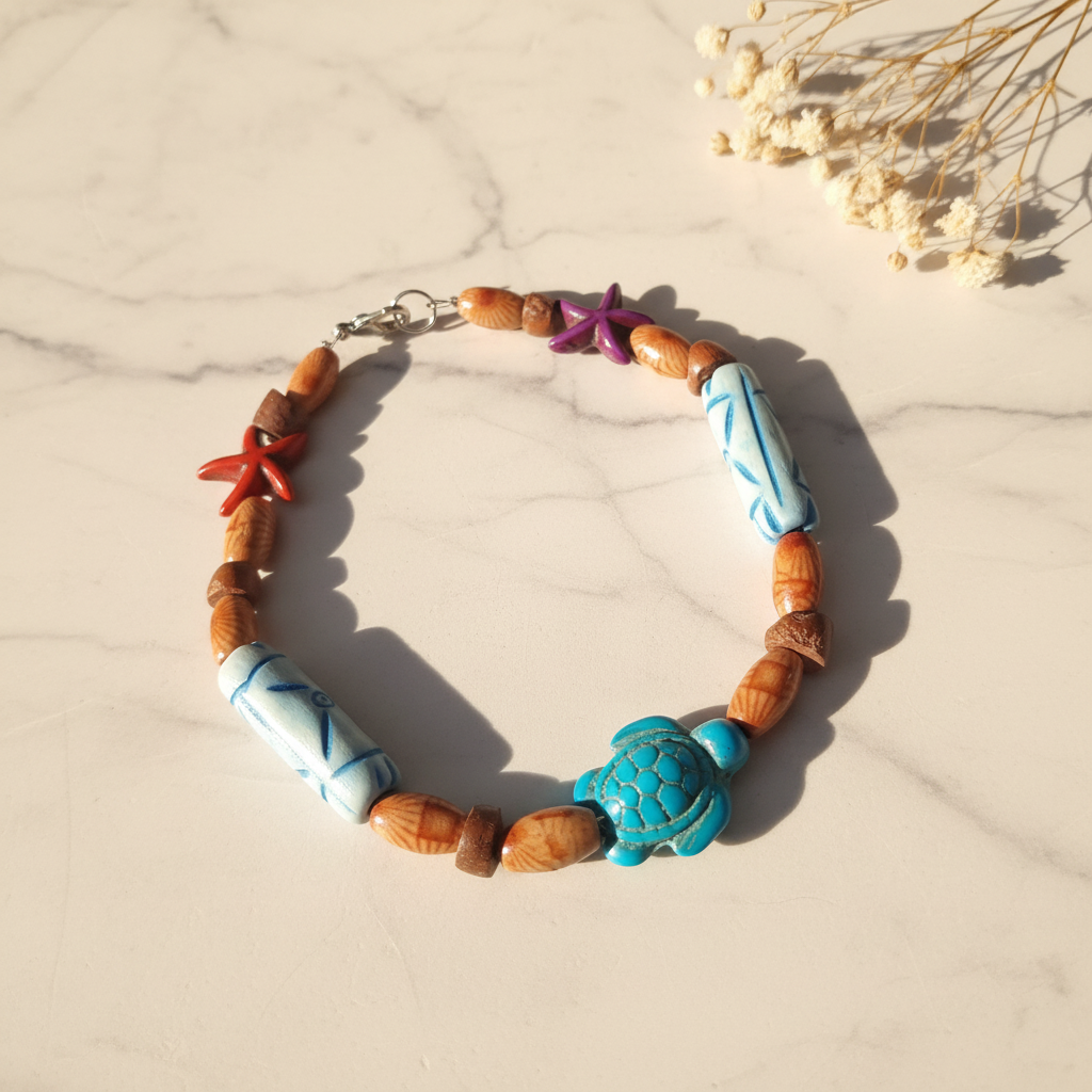 Wood bead bracelet with turquoise sea turtle and starfish on marble lifestyle